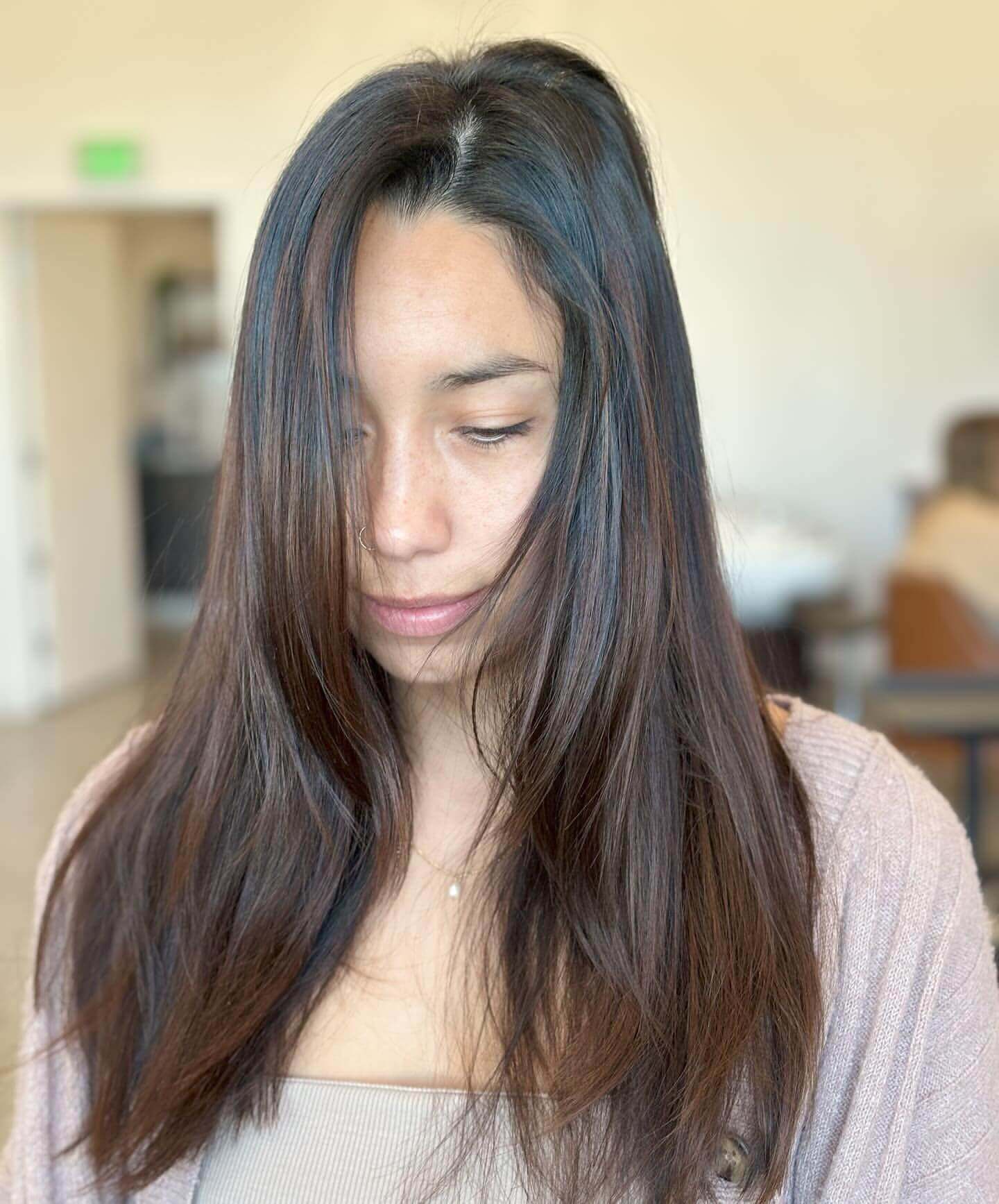 Sleek straight hair with subtle layers for a polished school appearance