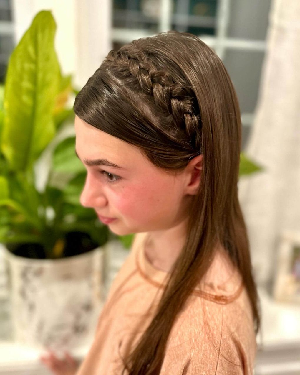 Long straight hair with a unique side braid perfect for back-to-school