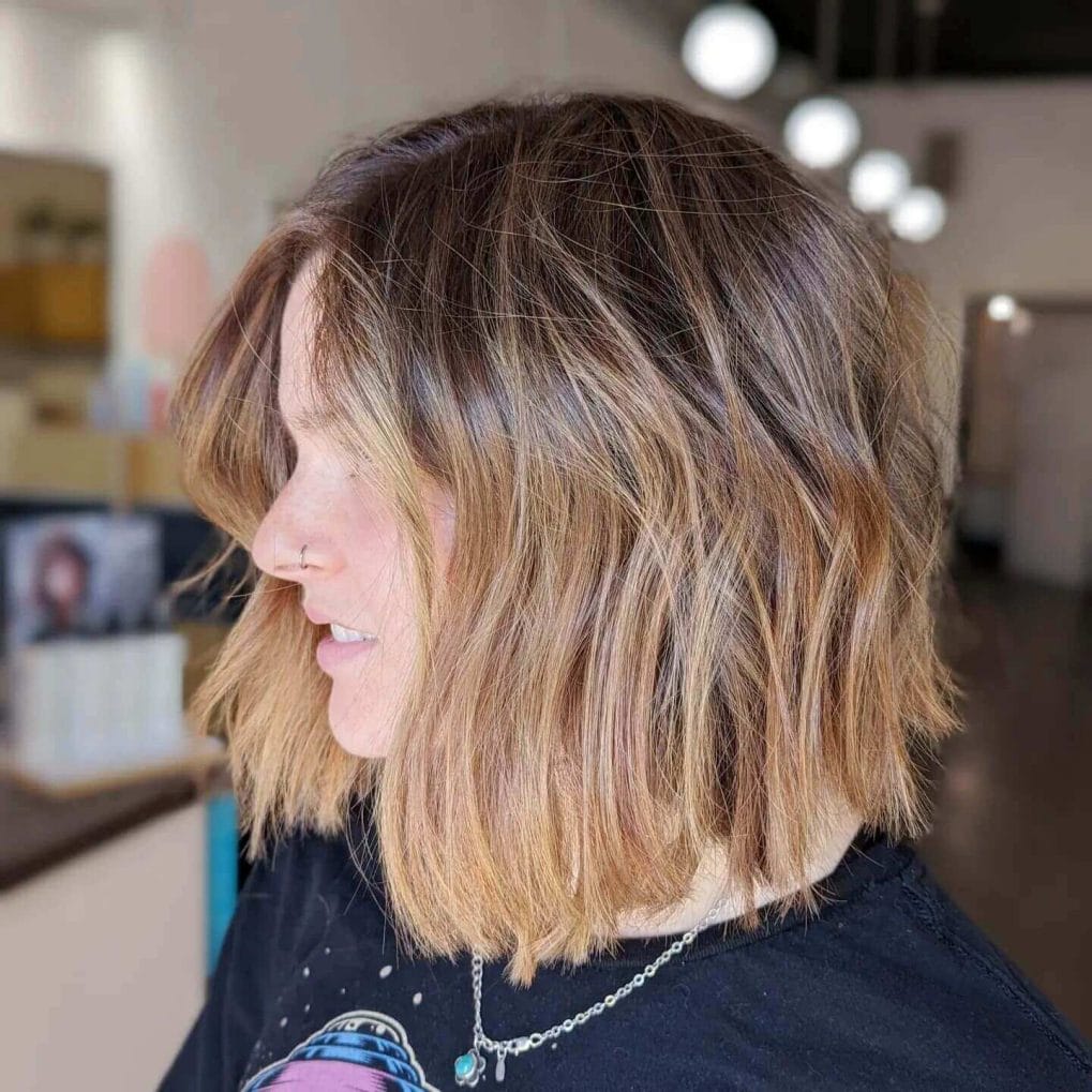 Beachy honey-blonde bob with modern curtain bangs