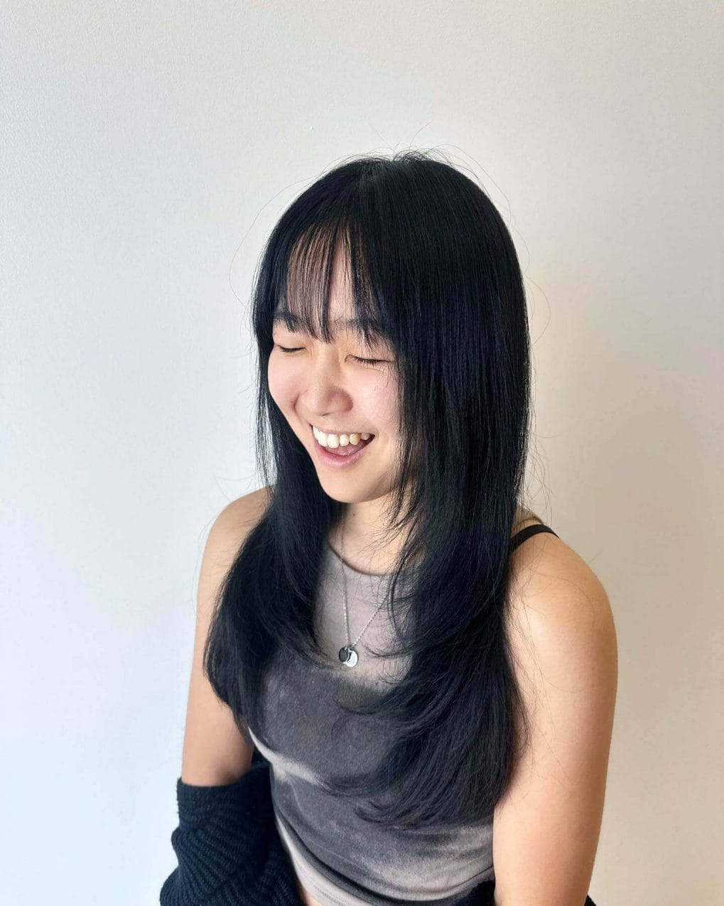 Voluminous black hair with see-through bangs