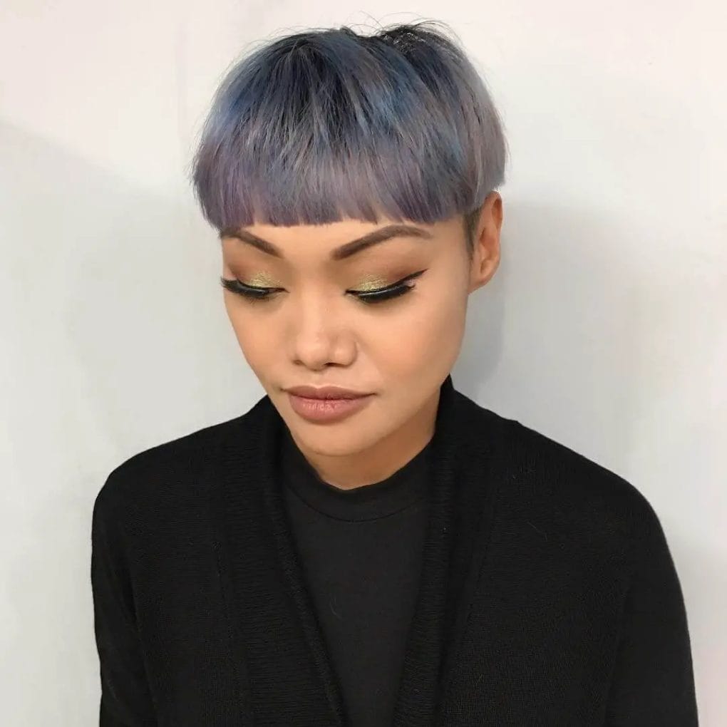 Creative mushroom cut with choppy fringe in icy blue and lavender hues.