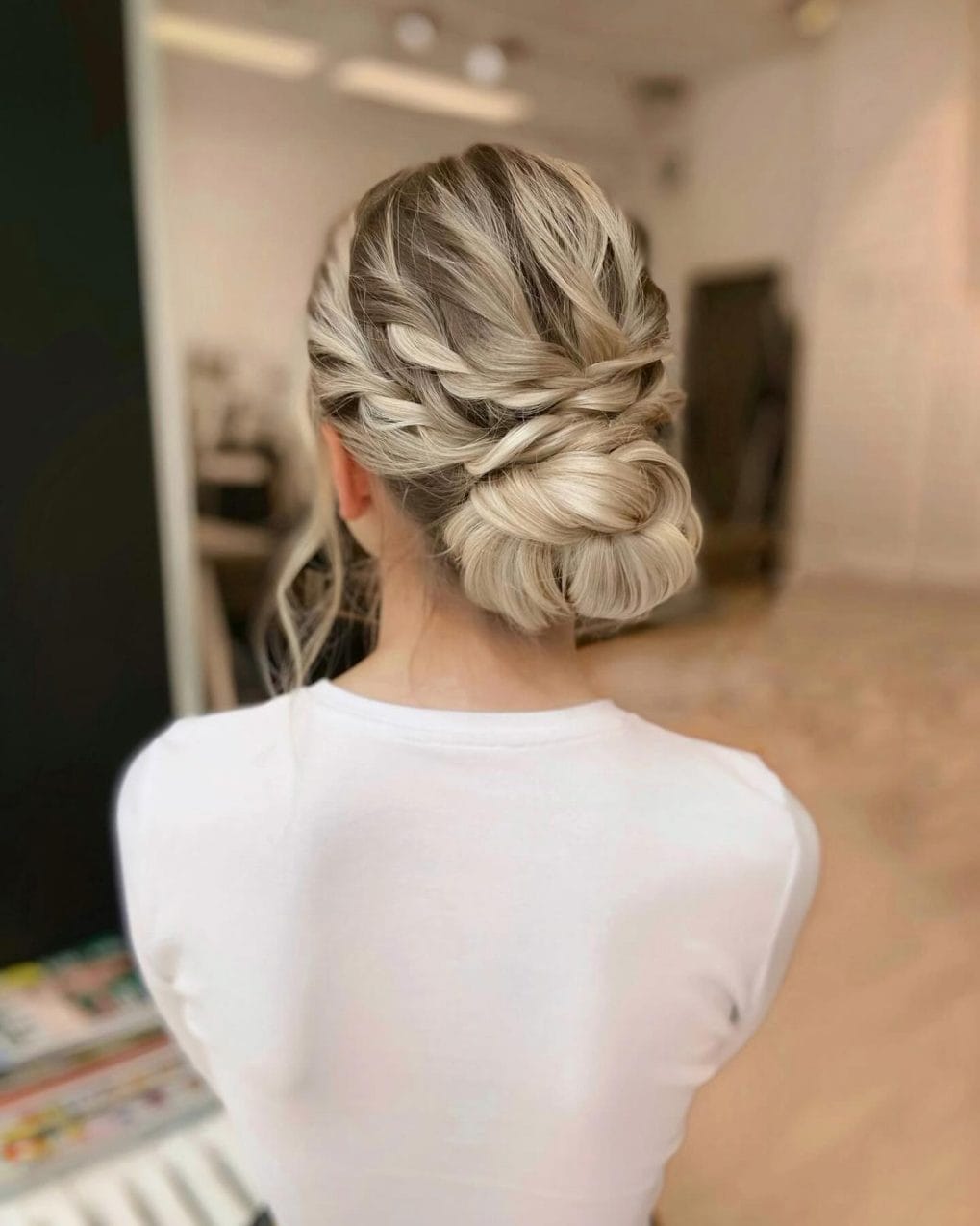 Sophisticated braided bun updo for hot summer days