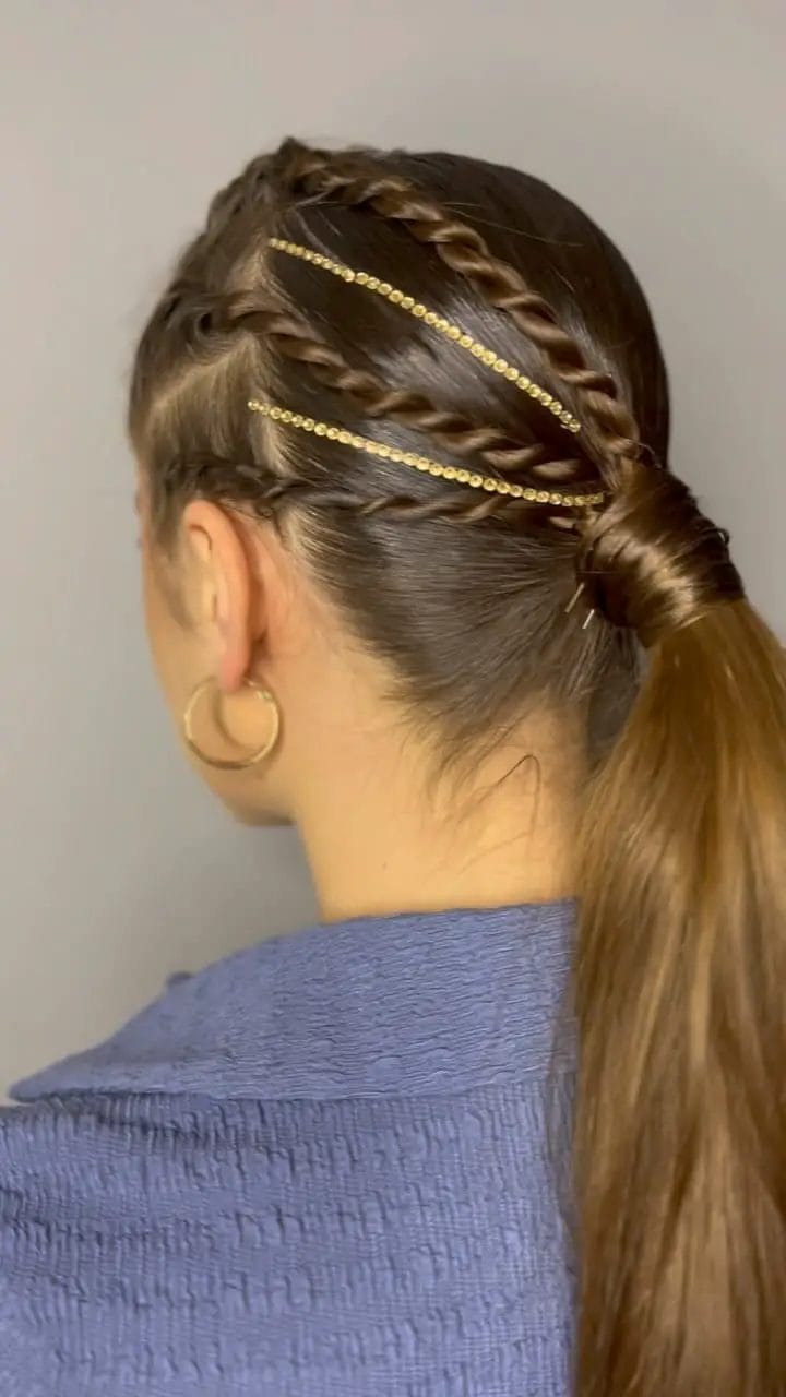 Sleek ponytail intertwined with gold beads for elegance