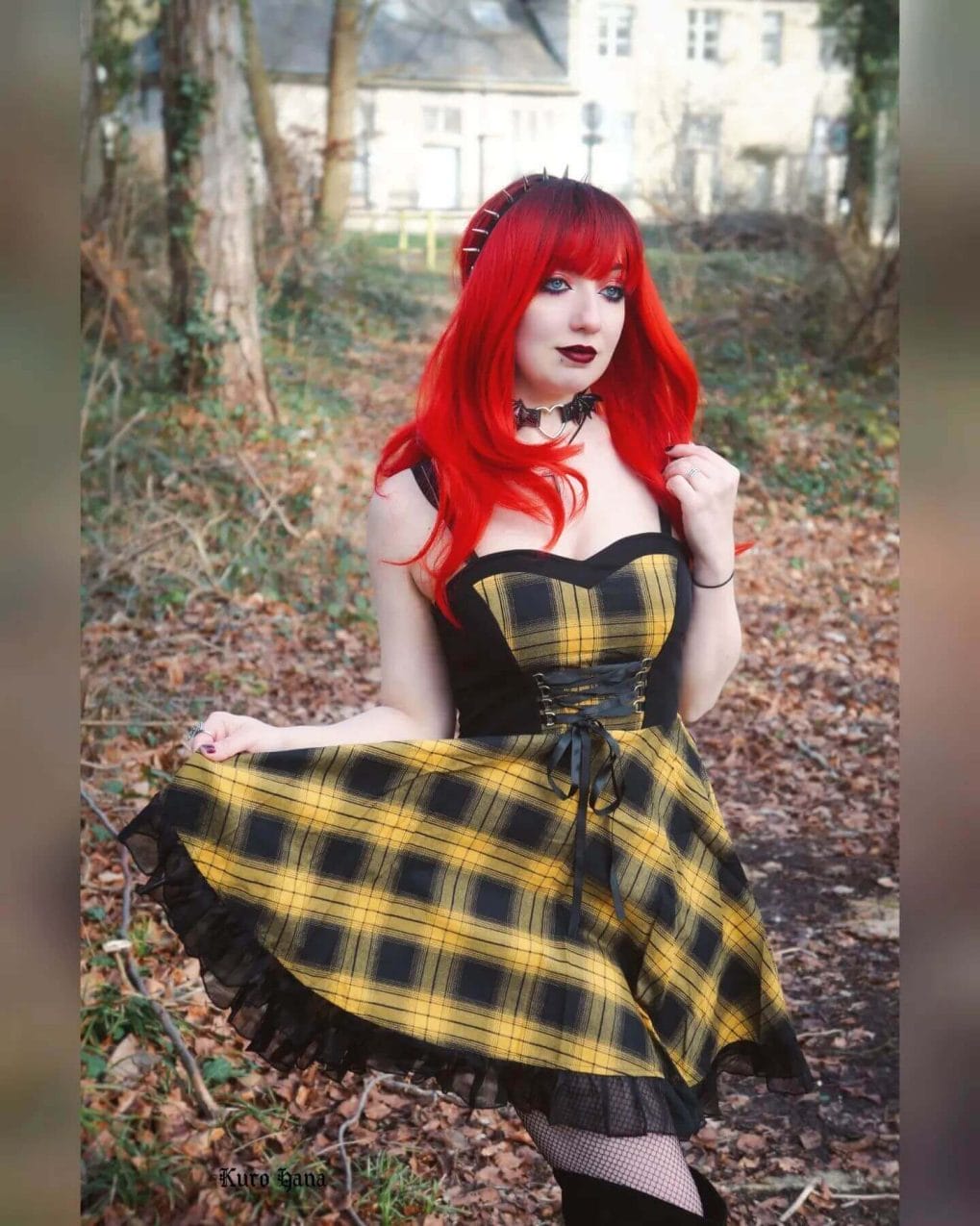 Bright red hair with spike headband and blunt bangs and gothic vibe