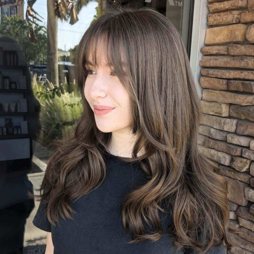 Brunette layers with see-through bangs
