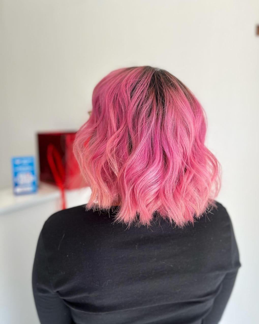 Sweet yet edgy bubblegum pink bob with playful layers
