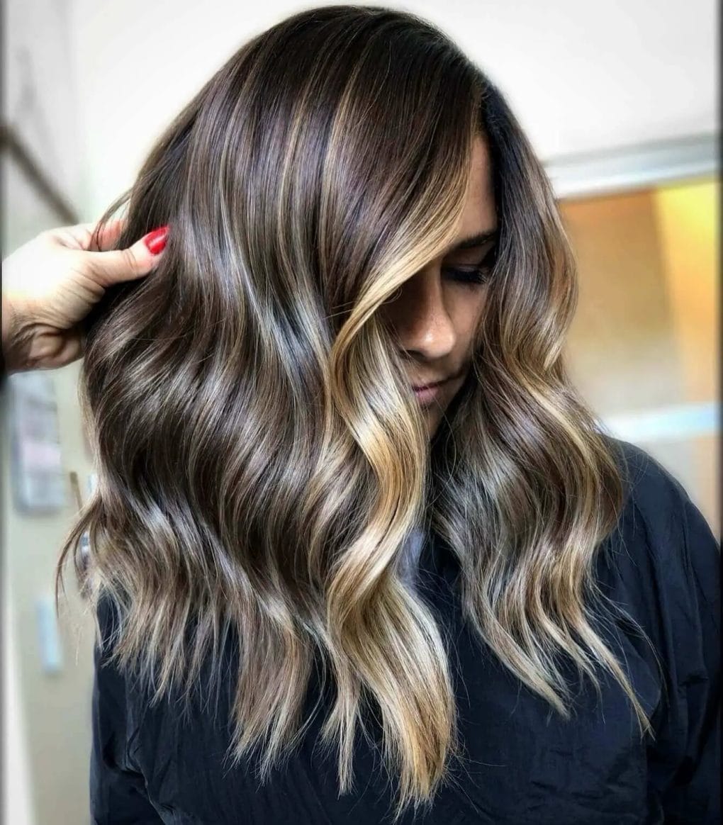 Subtle balayage with caramel ends and face-framing highlights