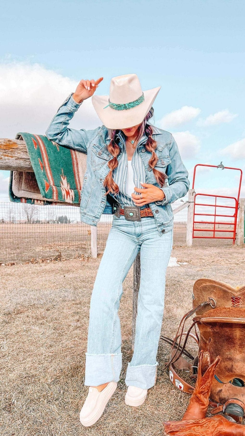 Caramel bubble pigtails under cream cowboy hat