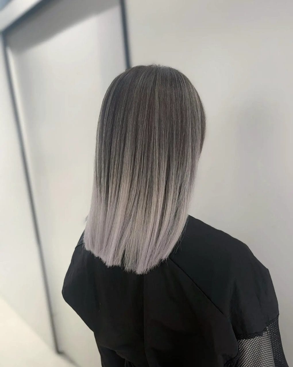 Straight bob with balayage from deep charcoal to frosty silver.