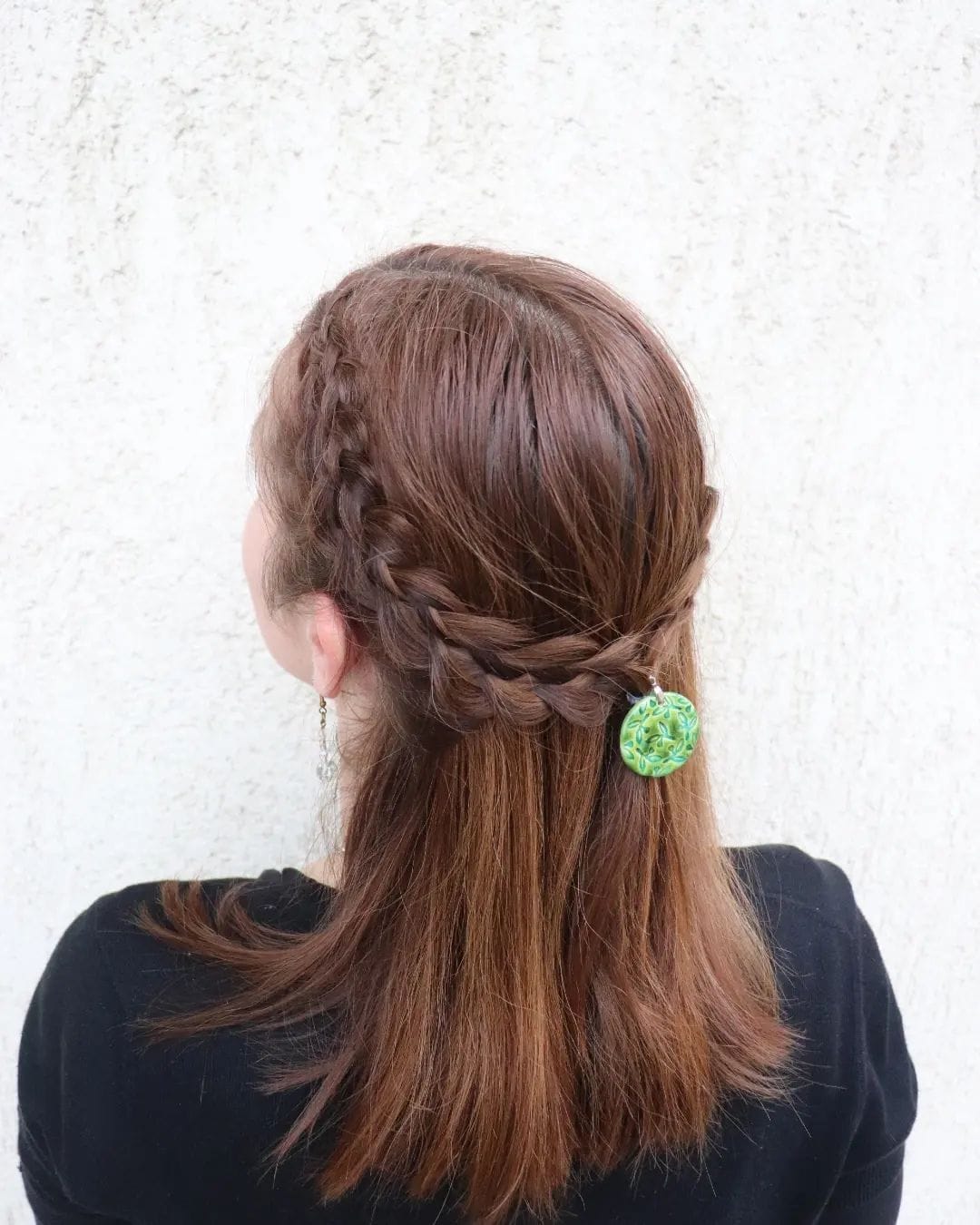 Simple chestnut brown hair styled with a playful half-up braid