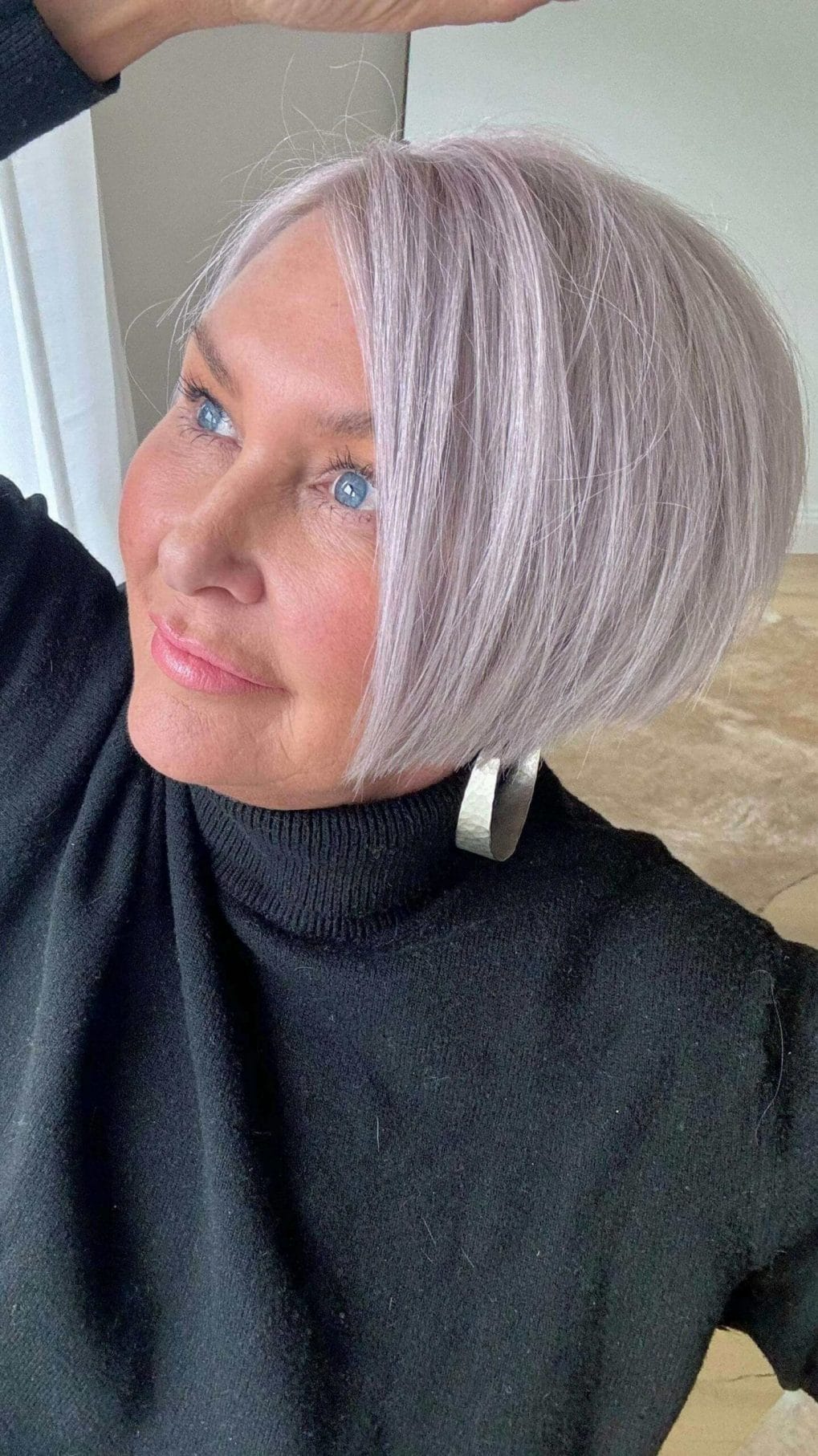 Chin-length bob with soft lavender hue and deep side part