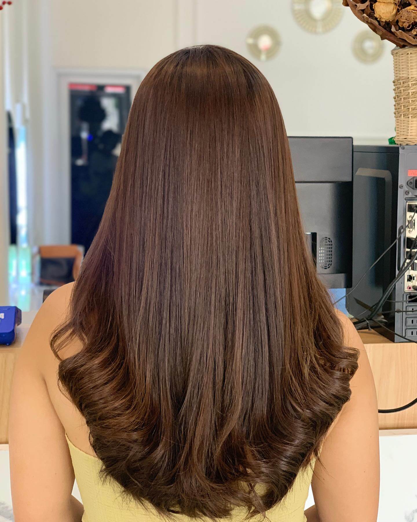 Silky chocolate brown U-shaped cut with harmonious inward-curled tips.