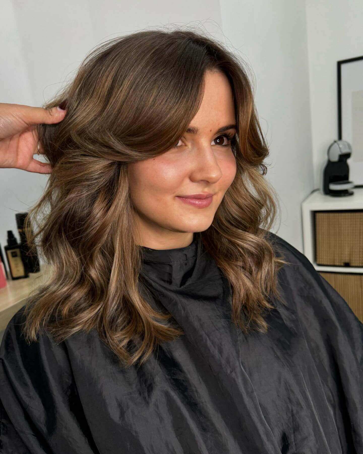 Chocolate and caramel balayage with gentle mid-length bangs