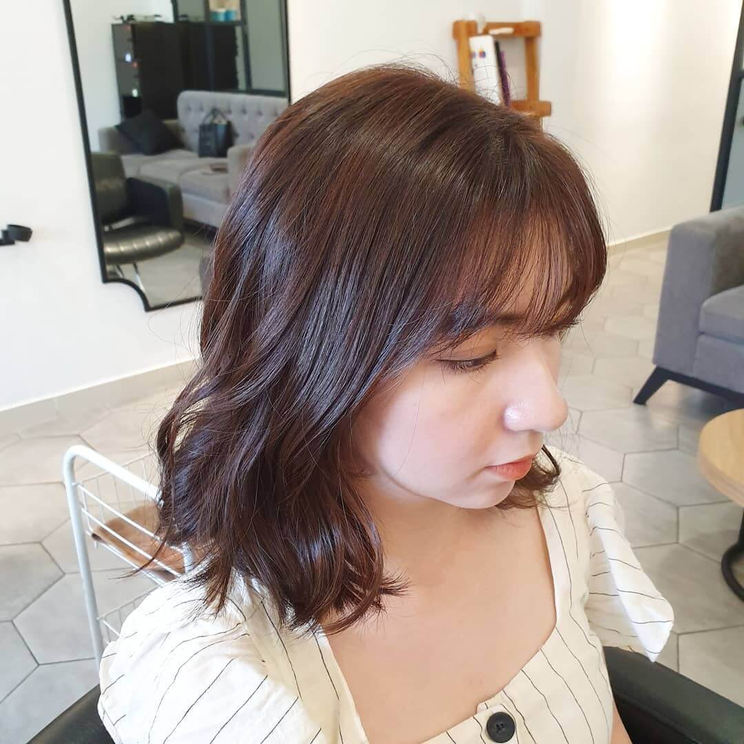 Chocolate brown bob with thin see-through bangs