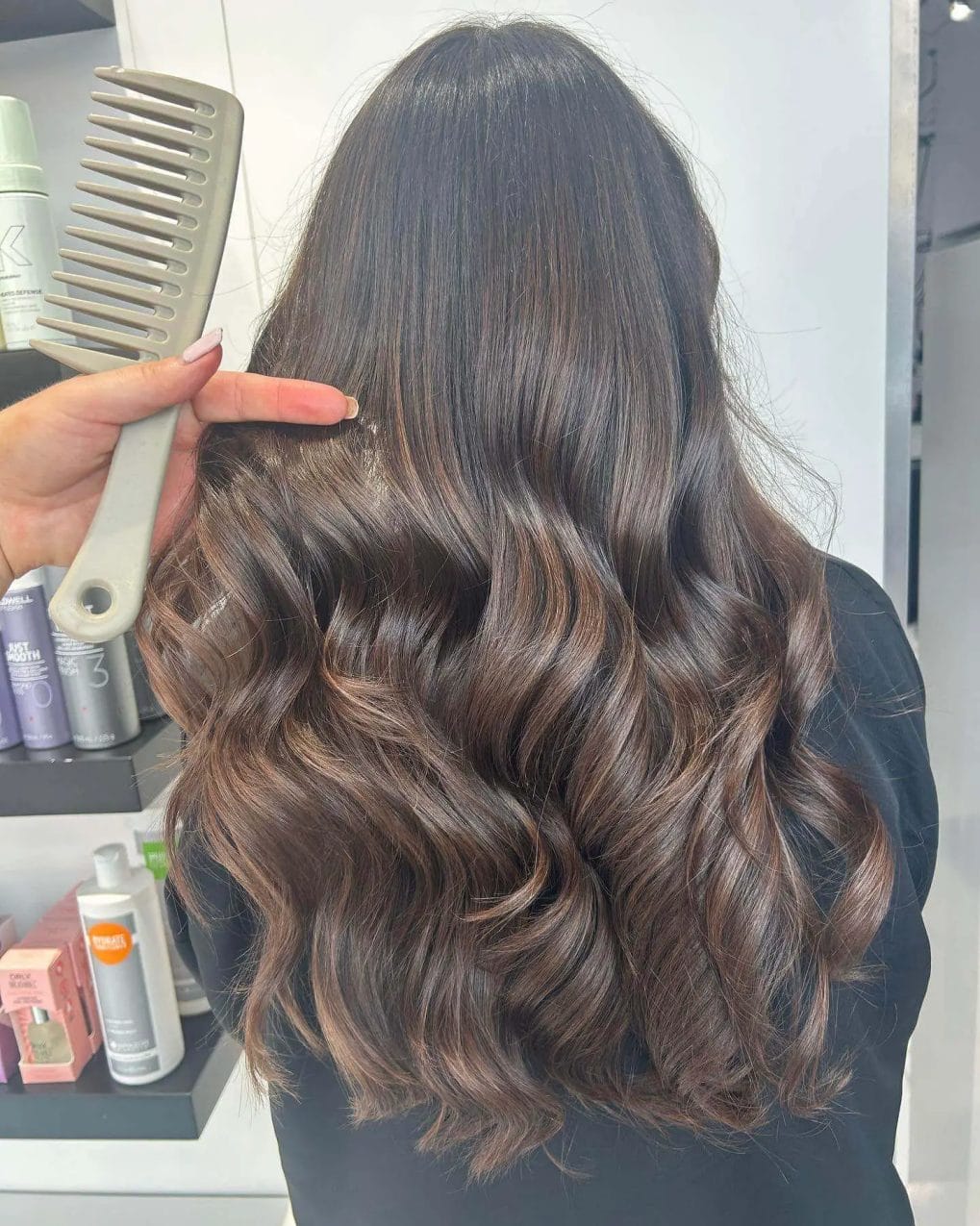 Dark chocolate base with soft mocha highlights, showcasing winter's classic balayage technique.