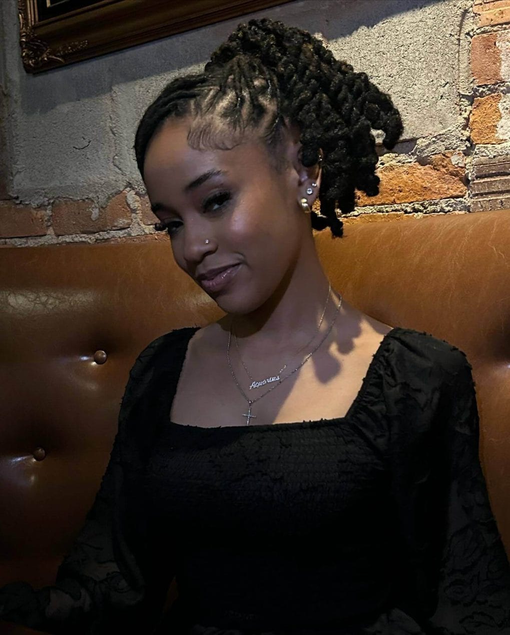 Chunky, ebony twists neatly side-parted for a sleek look