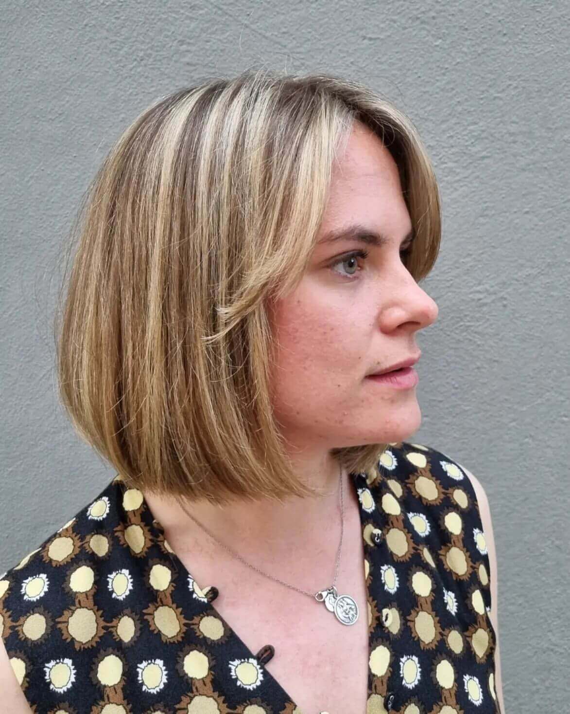 Classic above-shoulder bob with soft curtain bangs