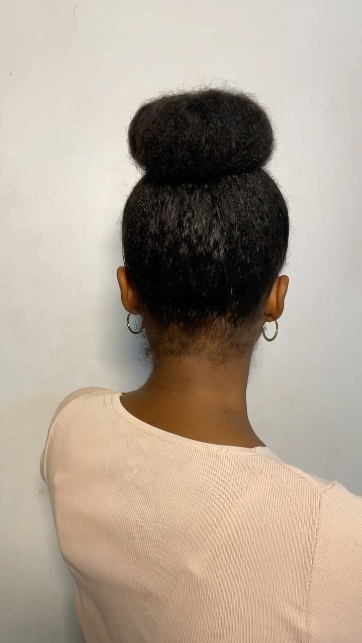 Cloud-like textured high bun on natural hair