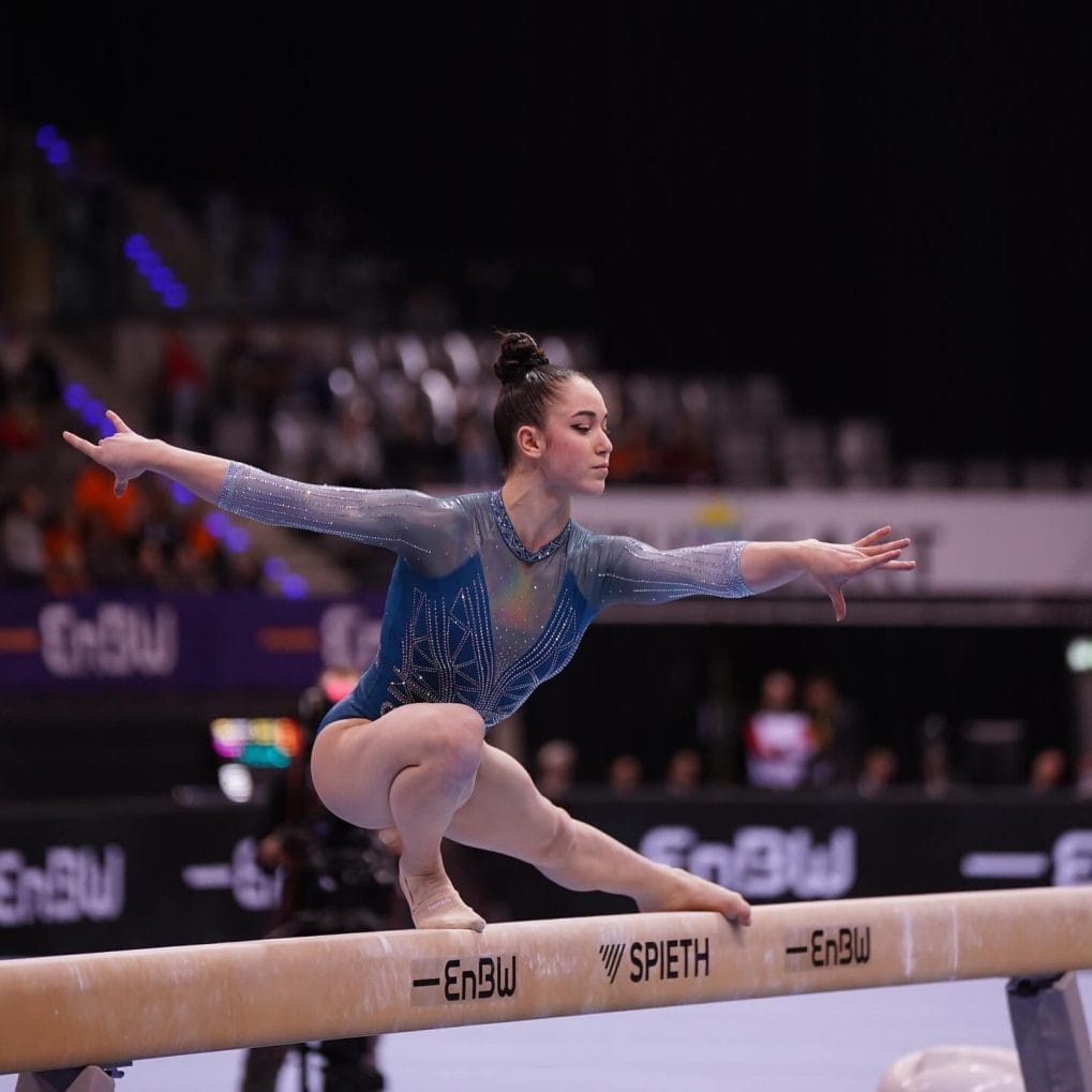 Glossy, high and tight classic bun ensuring no distractions during gymnastic performances