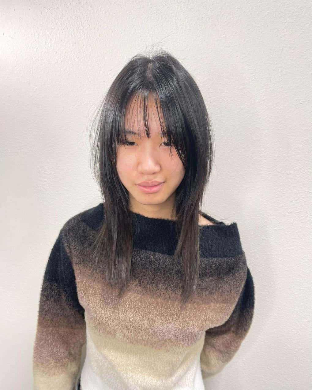 Jet-black straight hair with see-through bangs