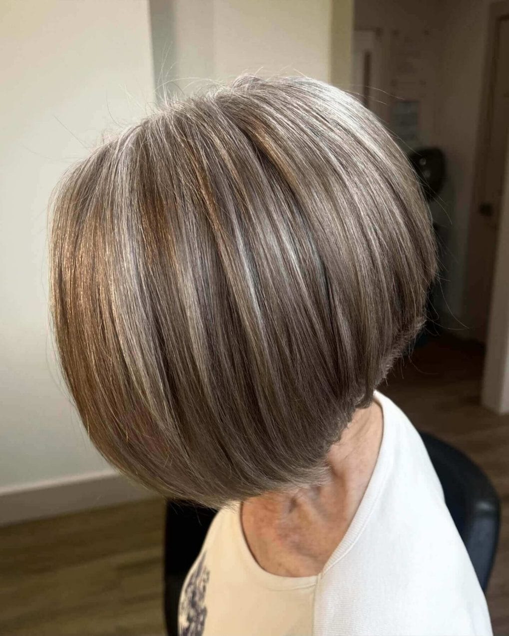 Soft rounded wedge haircut in silver and ash-blonde