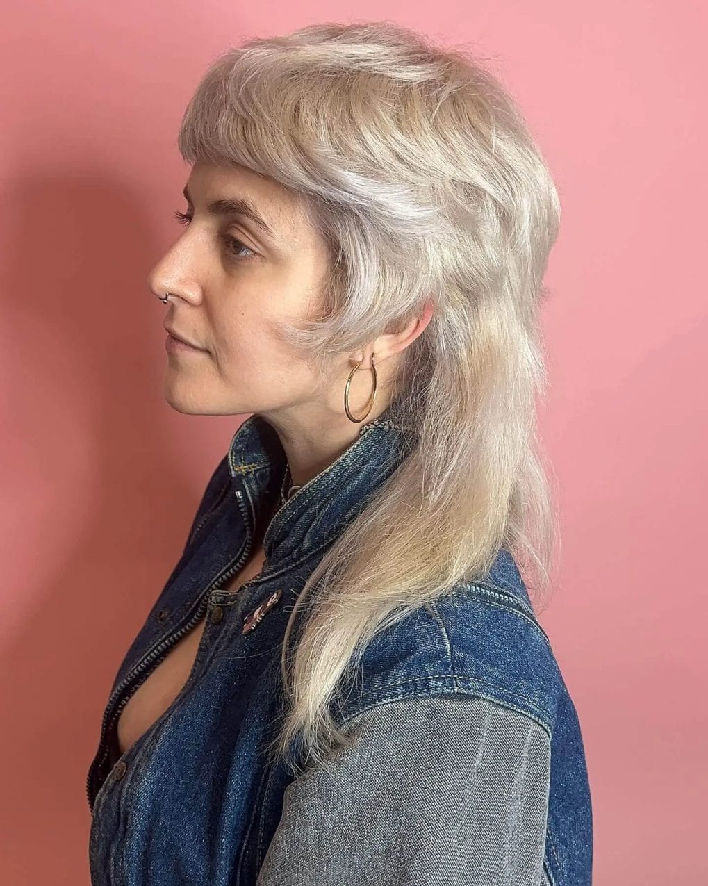 Classy silver shaggy mullet with volume at the crown and gentle waves