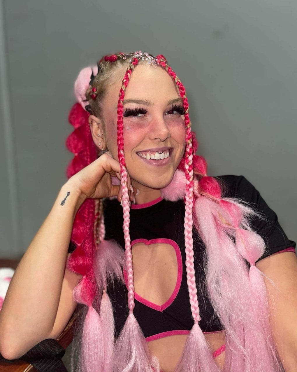 Pink braided hair with fluffy faux fur yarn and bead details