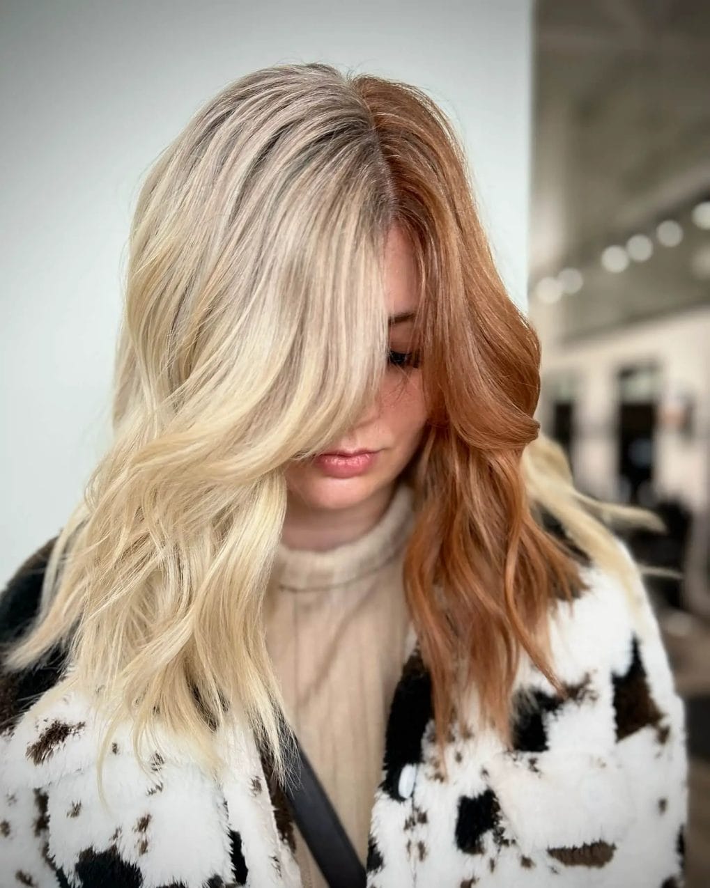 Cowboy copper and blonde waves in a subtle half and half style