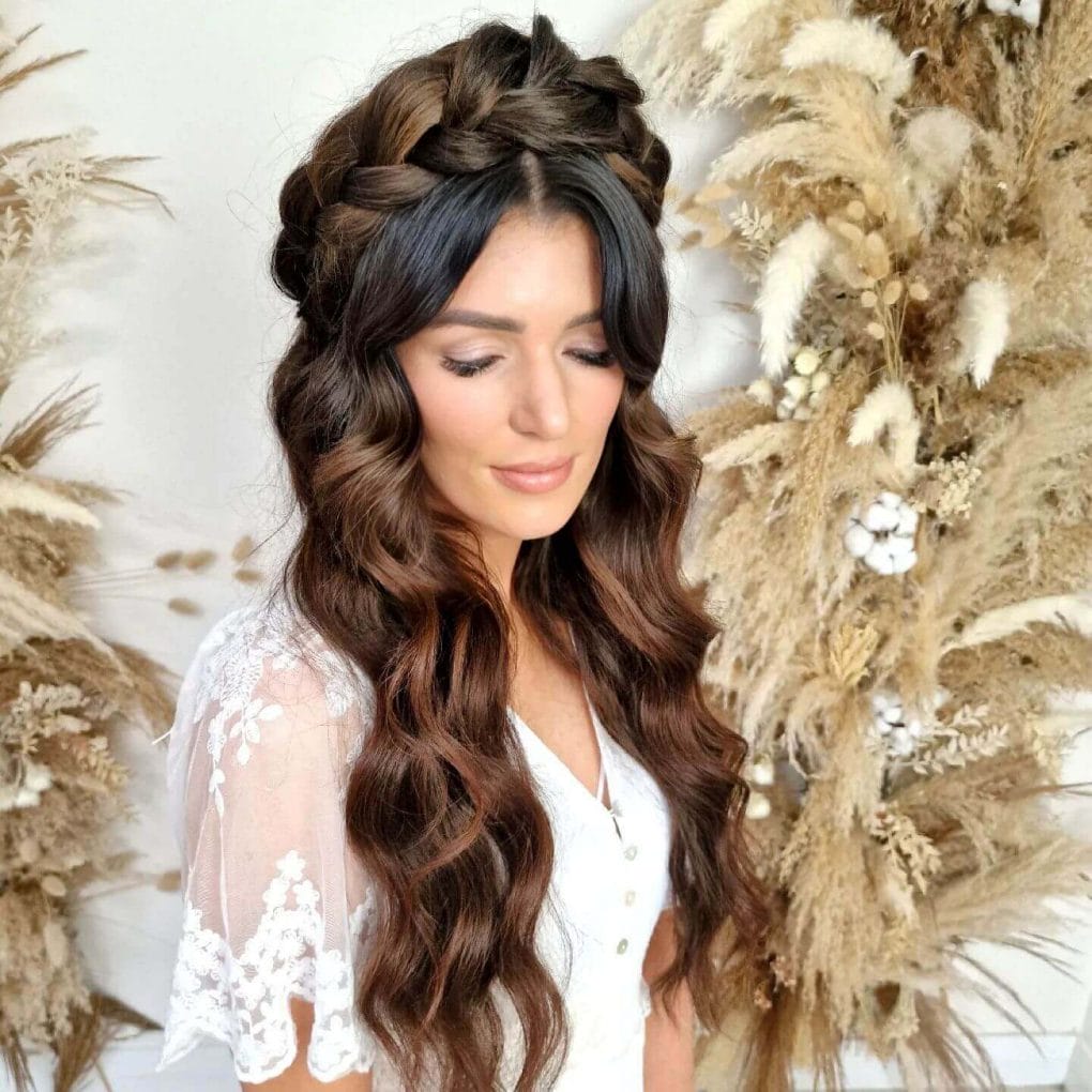 Crown braid circles head atop chocolate-brown waves