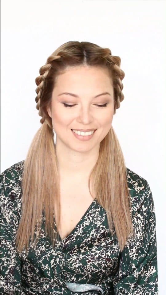 Light brown crown braids in a half-up style for a sporty chic softball hairstyle