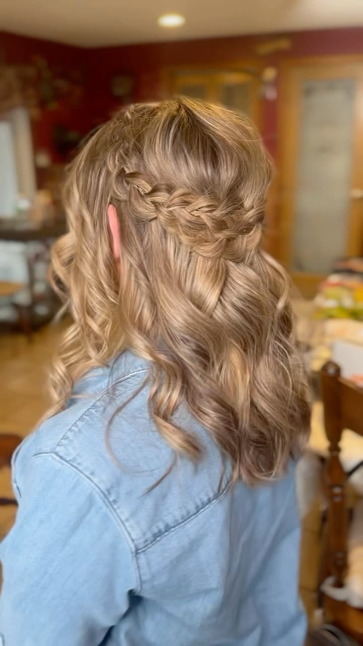 Crown-like half-up braid enhances blonde balayage waves