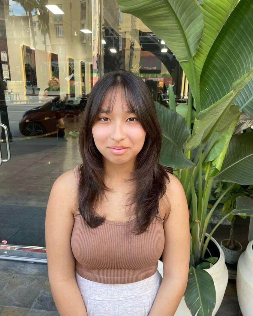 Medium-length dark brown layers with see-through bangs