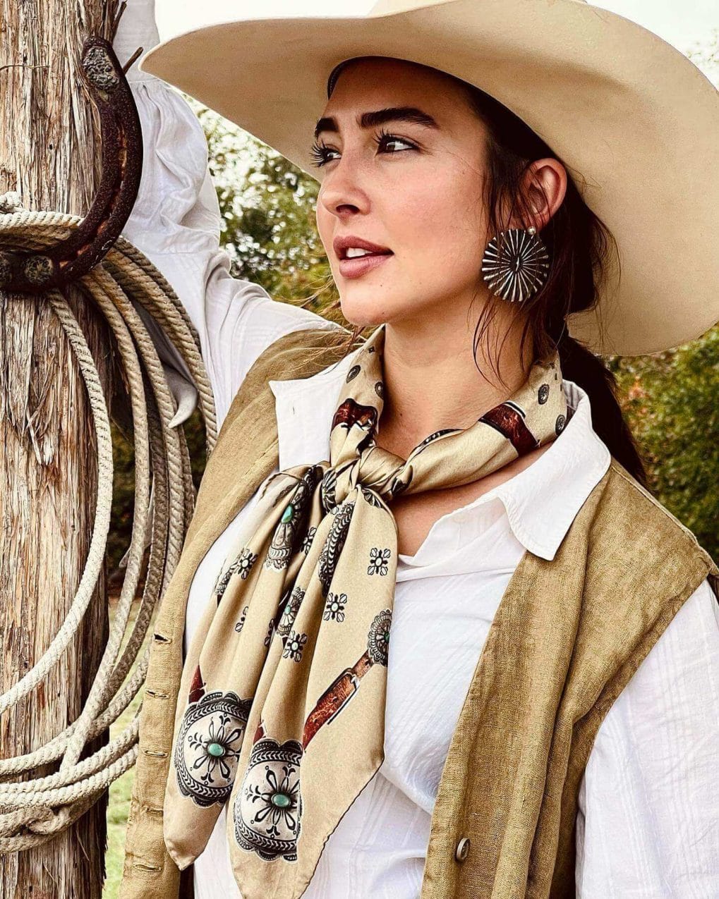 Dark brown ponytail paired with cowgirl practicality and charm