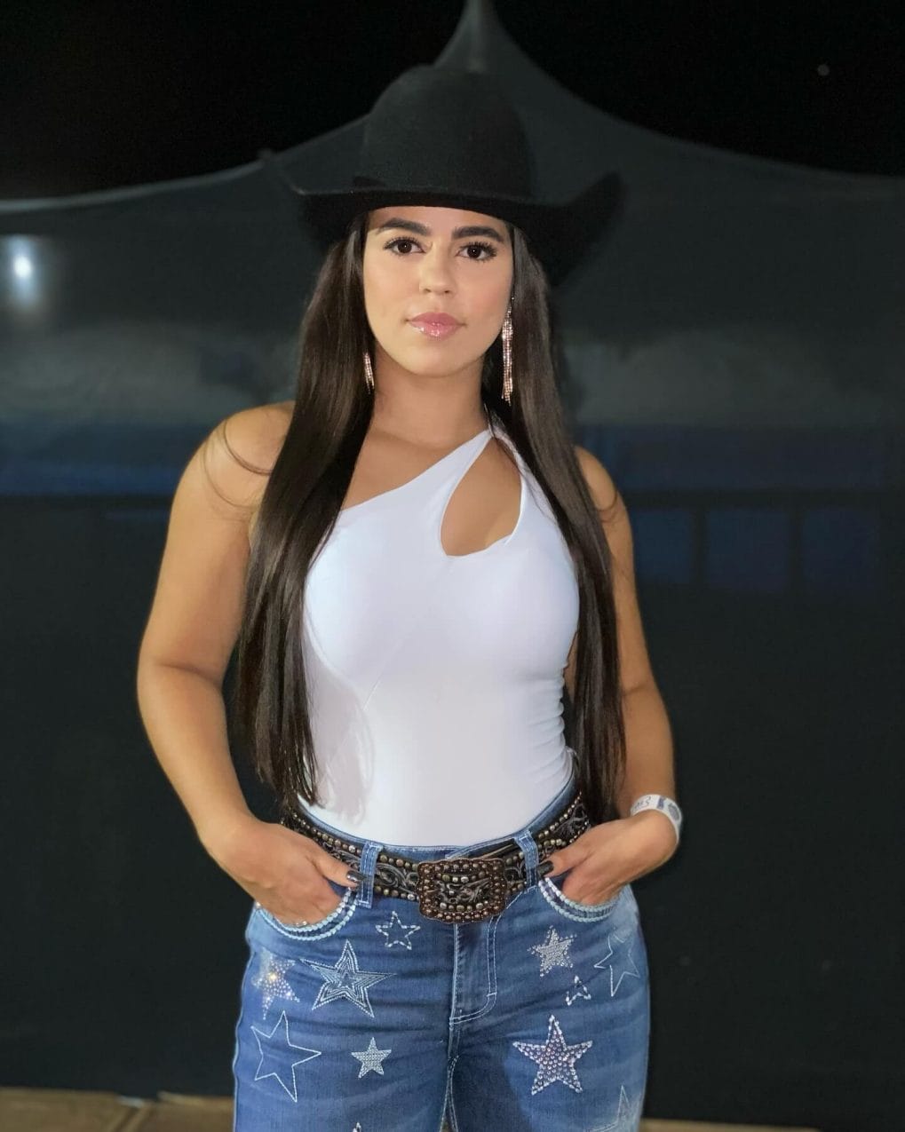 Straight dark hair in cowboy style