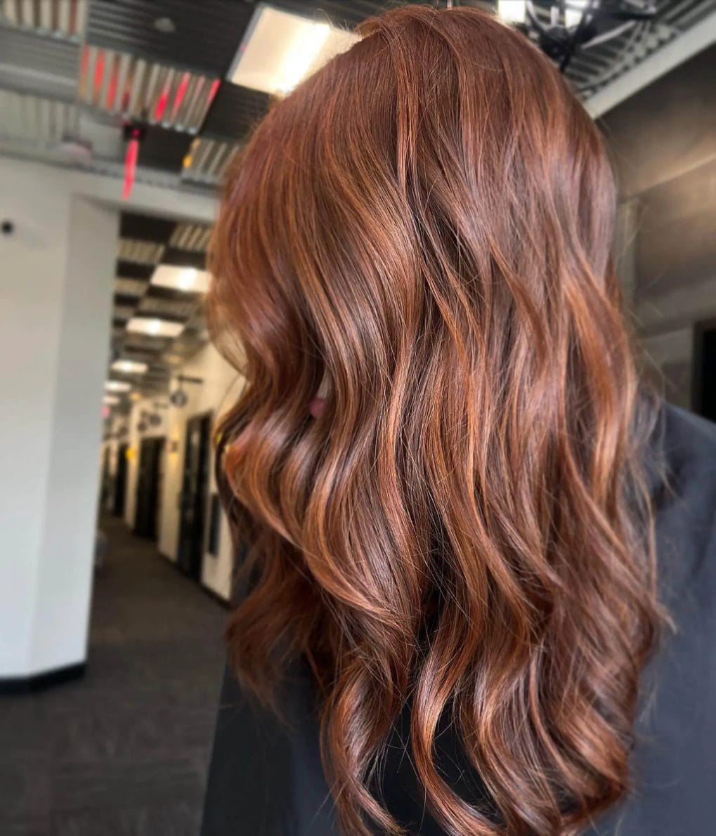 Deep copper tones in flowing layers with soft waves.