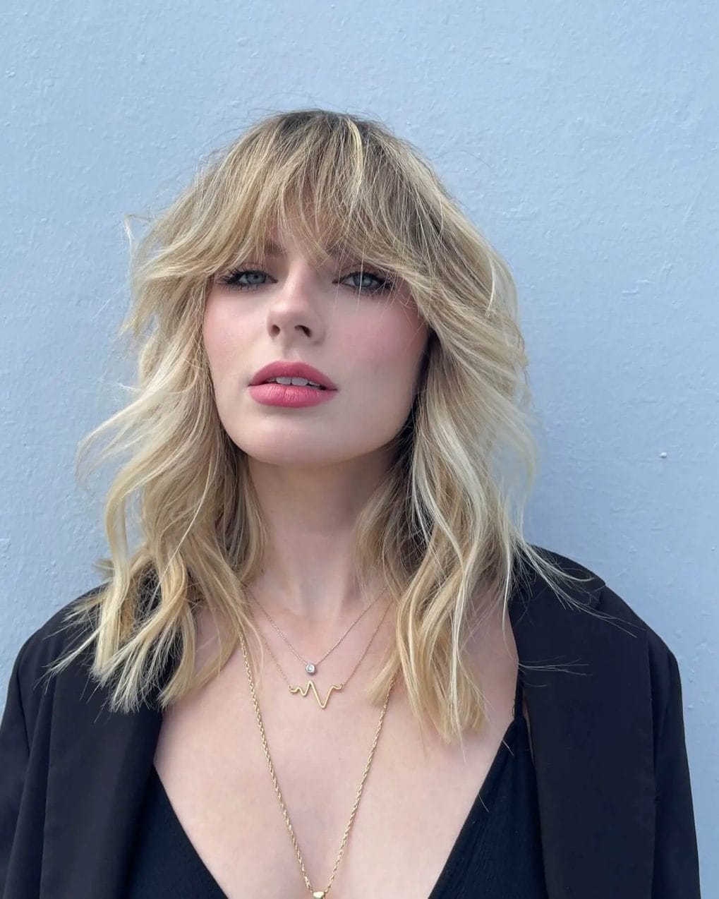 Textured blonde waves with modern shaggy curtain bangs