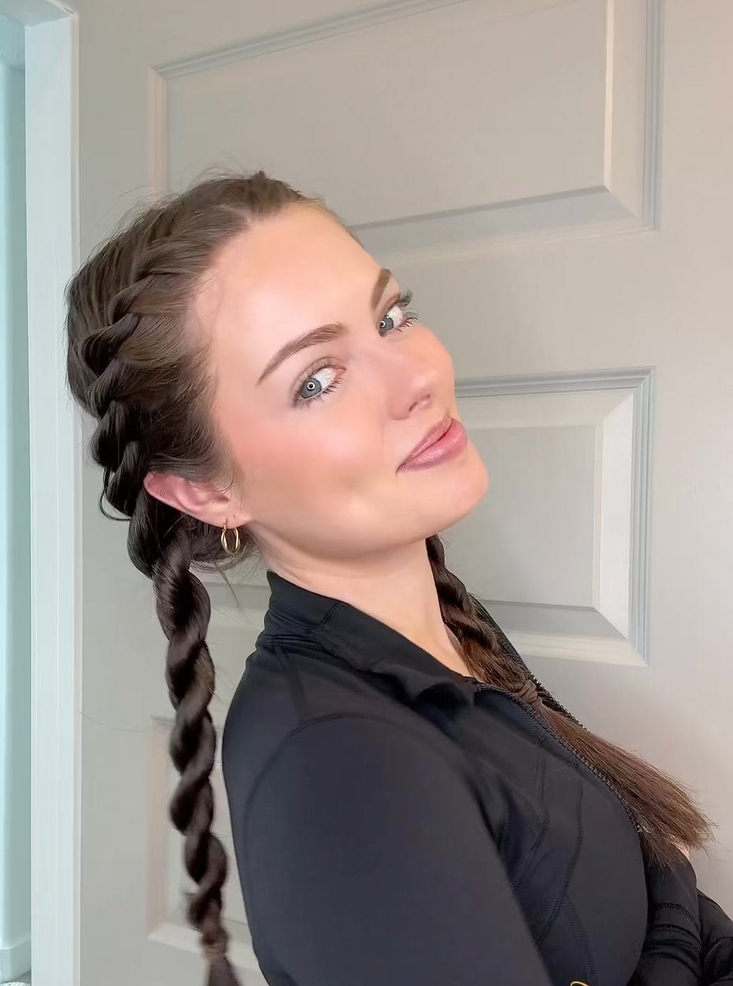 Dual braids into a long plait in deep brunette for a sporty softball look