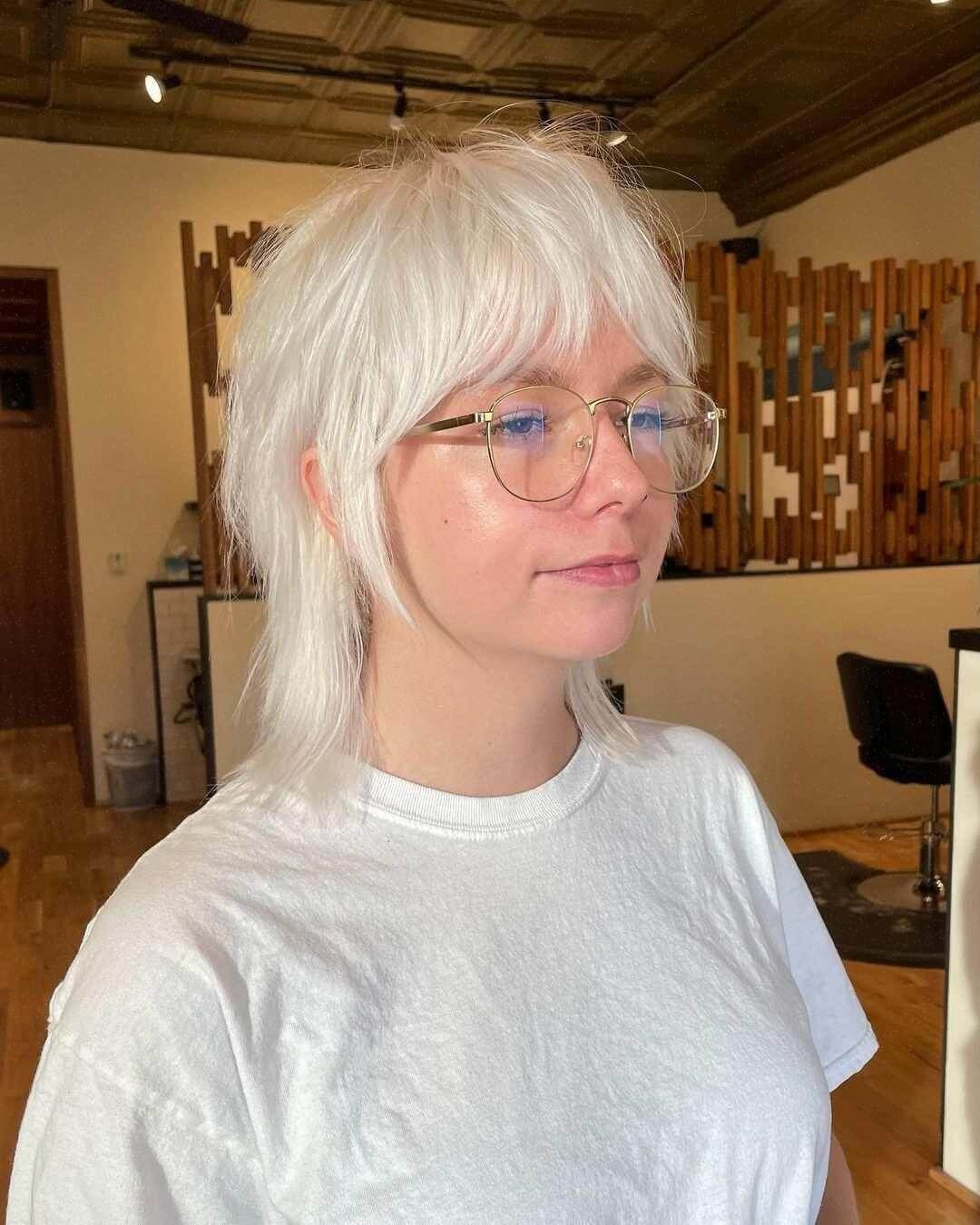 Edgy white shag cut with curtain bangs