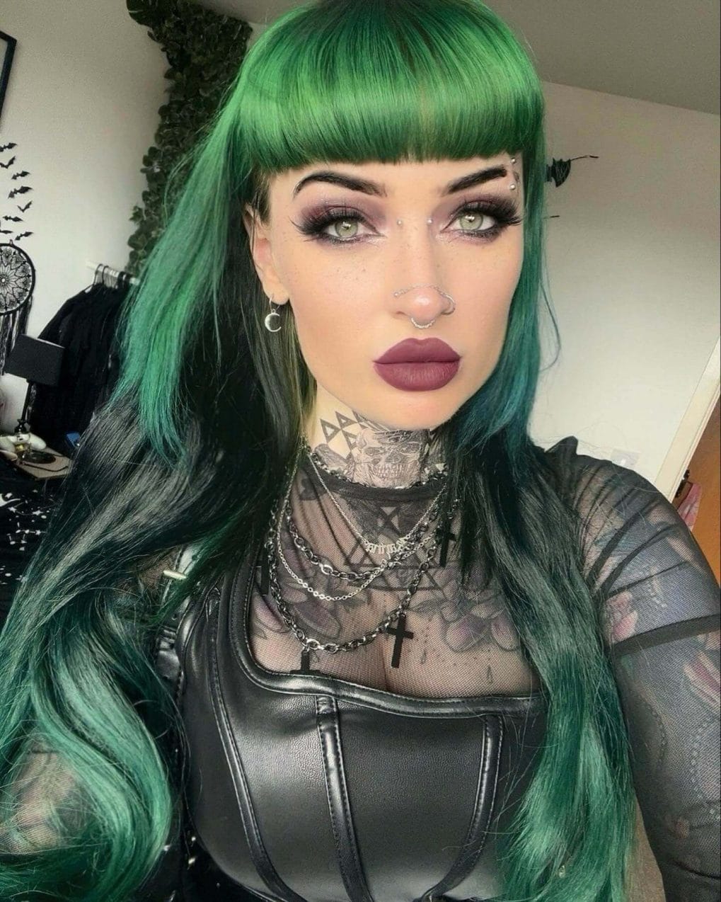Electric green wavy hair with full bangs and eyebrow accents