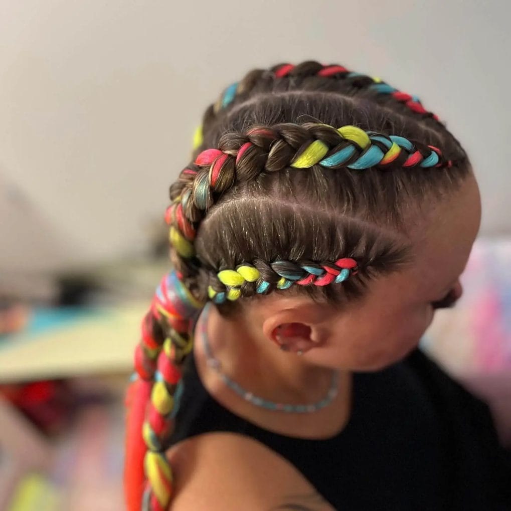 Bright neon yarn woven into Dutch braids with vibrant color pops