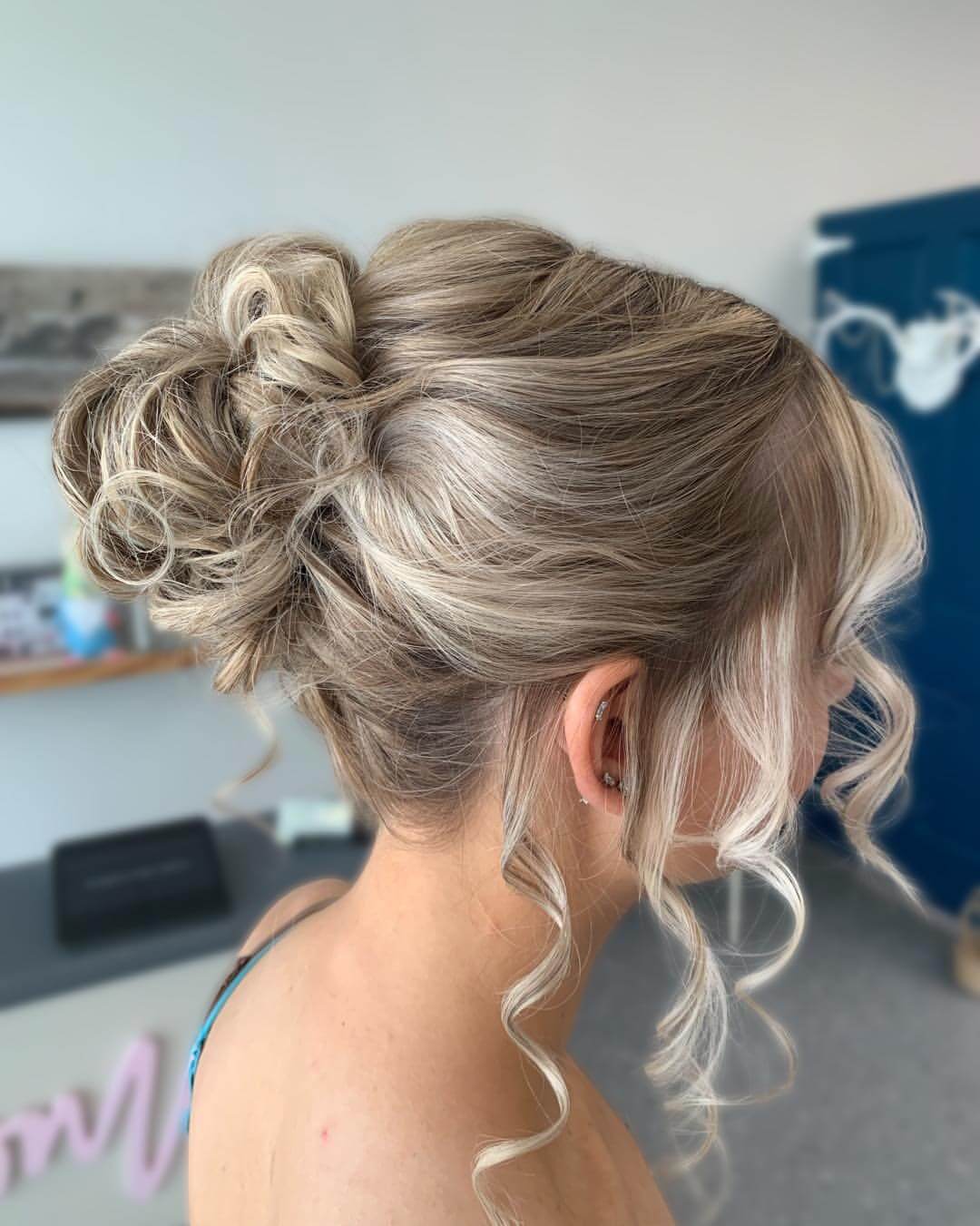 Elegant blonde updo with soft, voluminous curls