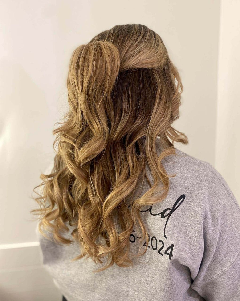 Elegant caramel highlighted curls for prom