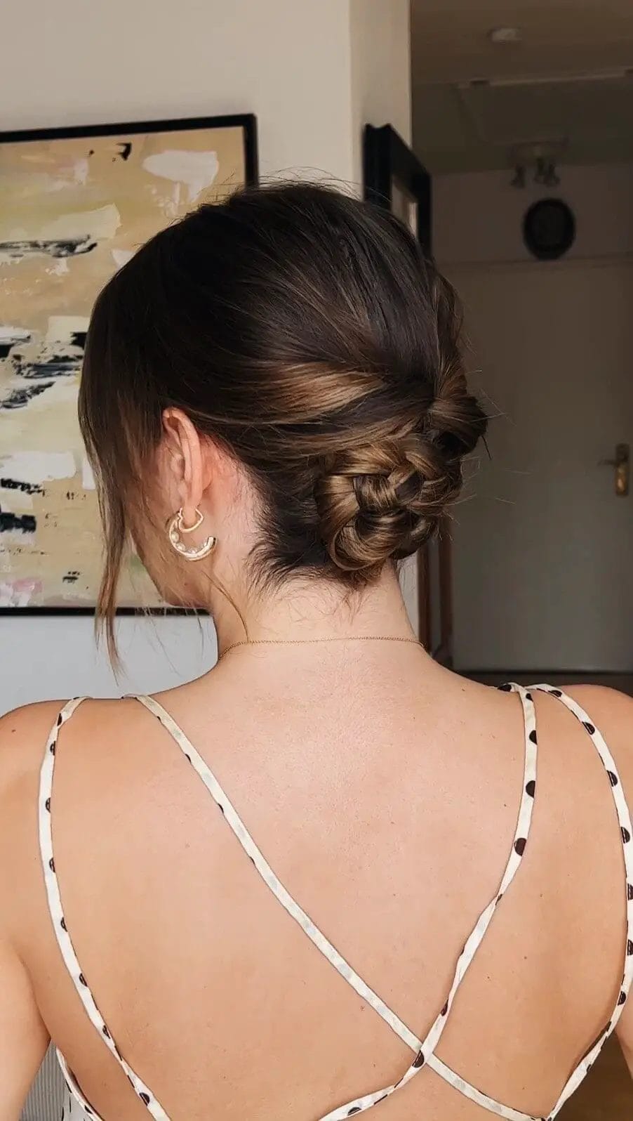 Elegant updo with strands twisted into a low bun