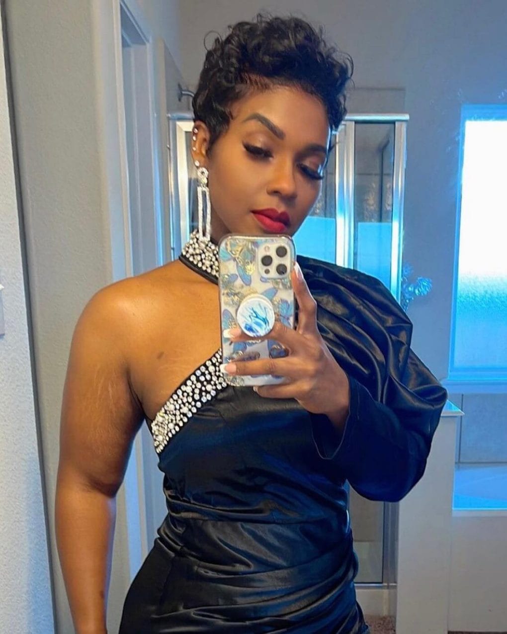 Short sophisticated wavy black pixie.