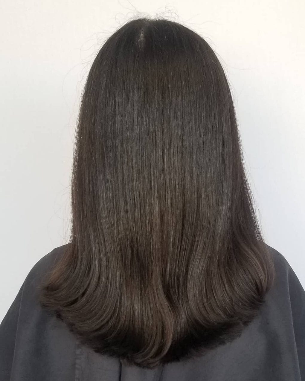 Thick U-shaped cascade in deep espresso hue showcasing natural undertones.