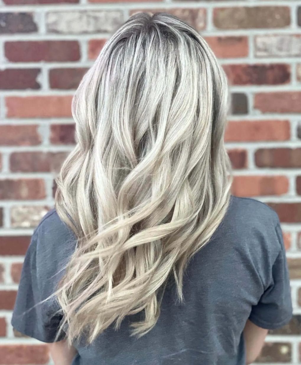 Ethereal muted blonde with long, voluminous layers