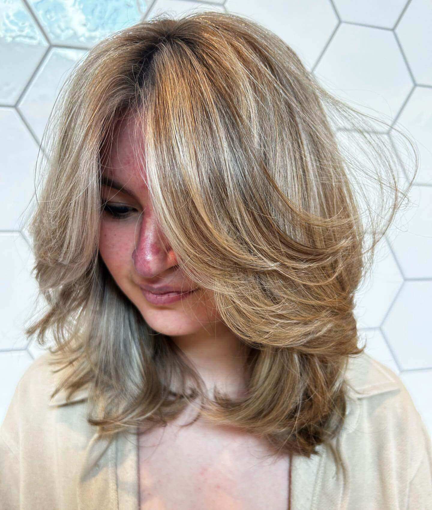 Feathered layers with elegant curtain bangs