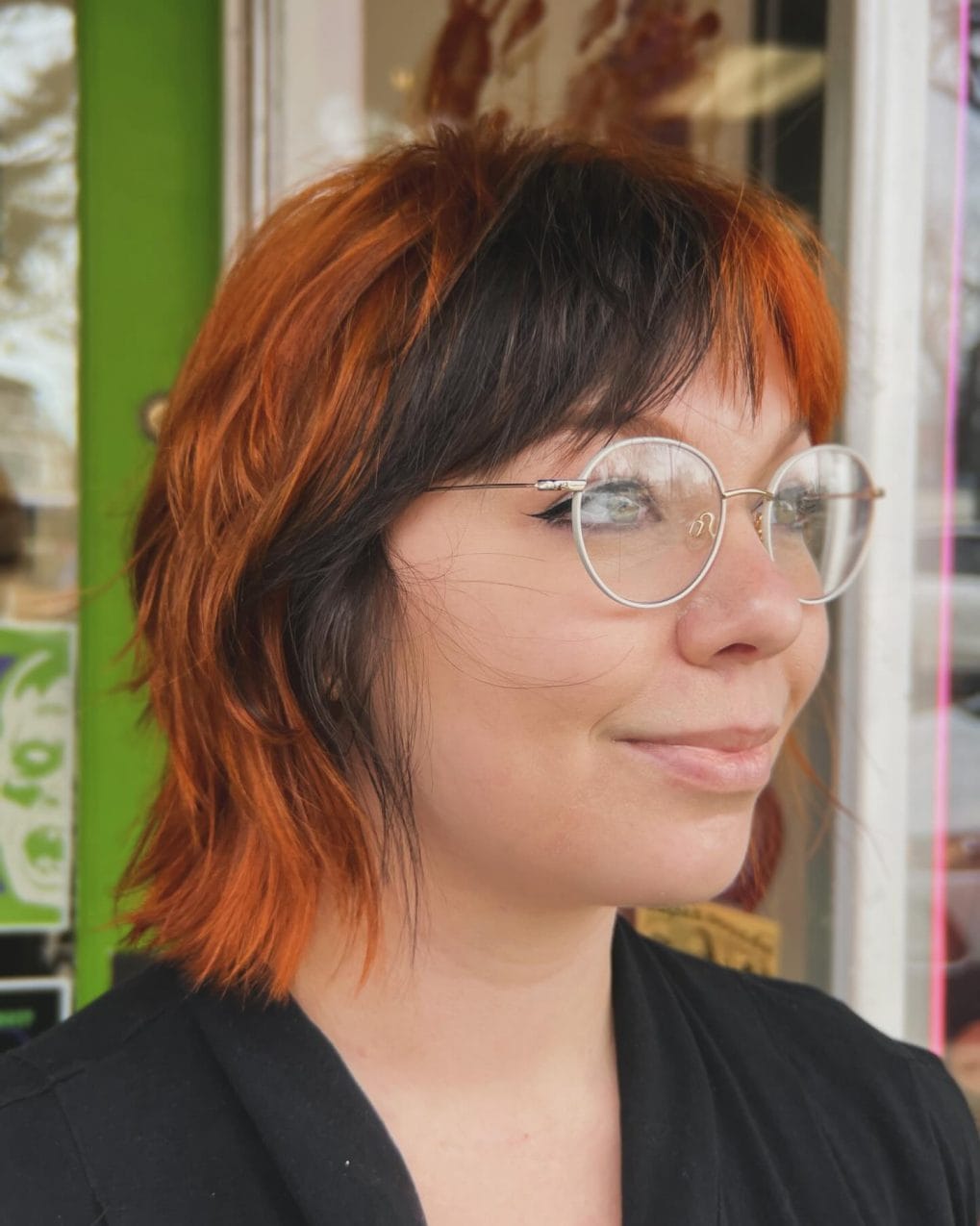 Fiery orange short bob with piecey bangs and black underlayer