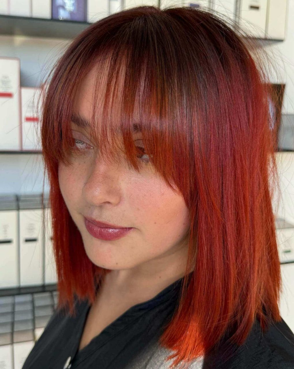 Red bob with edgy see-through bangs