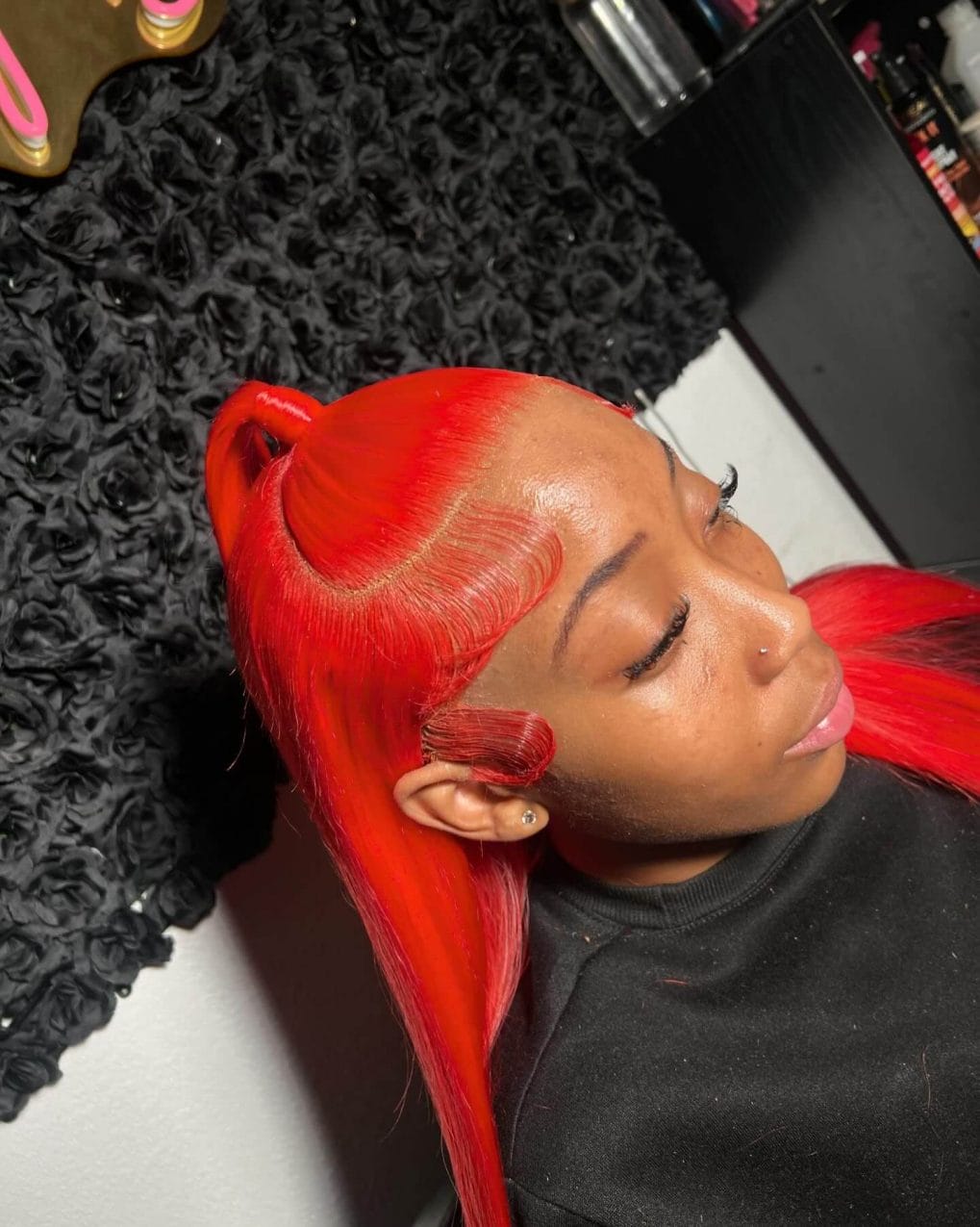 Fiery red straight hair with bold side-swept frontal